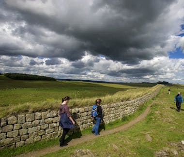 Groups of walkers along Hadrian's Wall near Haltwhistle, Northumberland